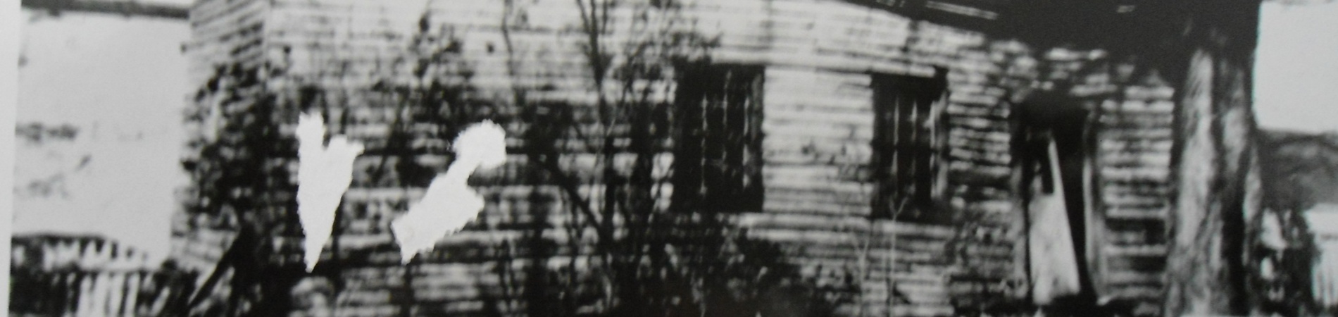 black and white photo of a former slave cabin