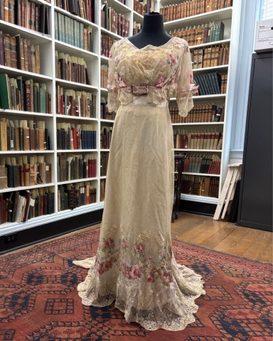 Cream dress with pink rose embellishments from 1908
